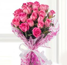 Pink Roses Bunch; This is a bunch of 12 Pink Roses wrapped with a pretty ribbon. Pink roses signify elegance, gentility
