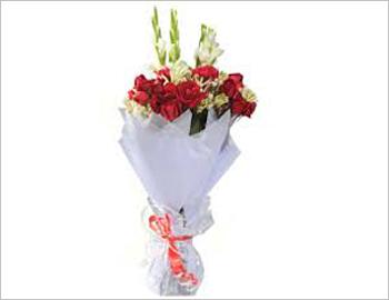 Sheet Bouquet (Small); A smaller version of a mixture of long stemmed roses, gladioli, purple, white or yellow asters with golden rods used as an attractive filler - this bouquet is arranged on a white wax paper and covered with glass paper in the front - a perfect bouquet